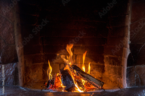 Hot fireplace full of fire wood