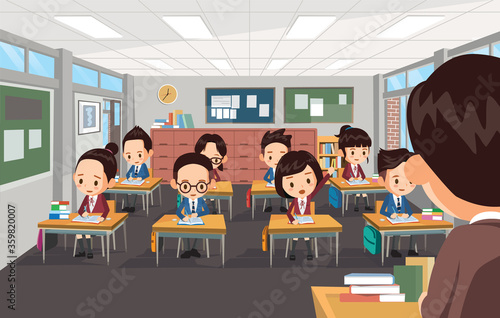 The teacher is teaching students at school
