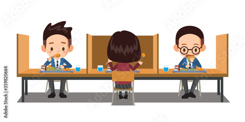 Students sit apart and have lunch at a social distance. A partition between children prevents the virus.