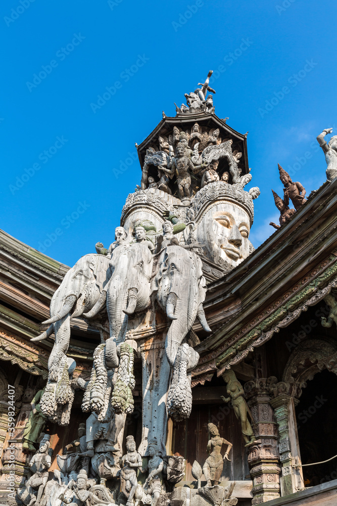 Two faces and three elephant heads sculpture on Sanctuary of Truth roof