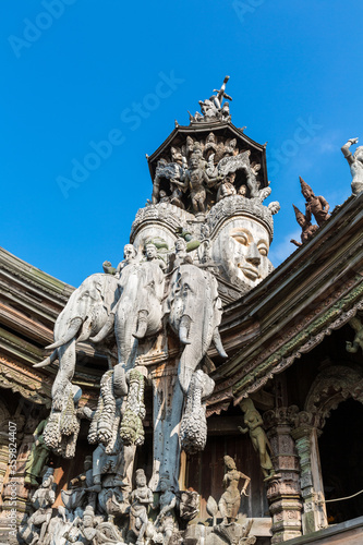Two faces and three elephant heads sculpture on Sanctuary of Truth roof