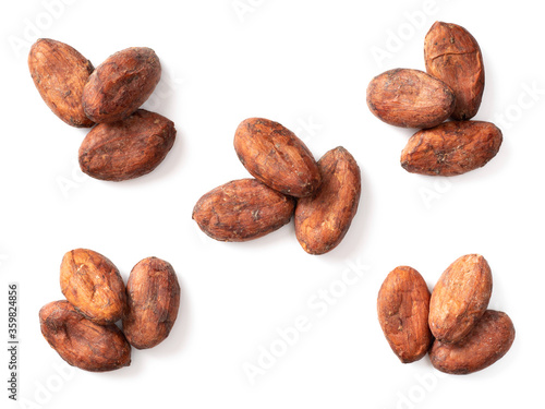 dried cocoa beans isolated on white background, top view