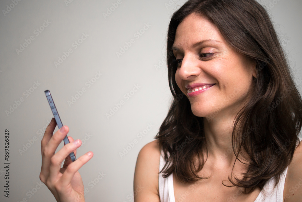Face of happy beautiful woman using phone Face of happy beautiful woman using phone