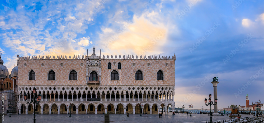 Doge's Palace and Saint Mark column of the Lion at Saint Mark's San Marco square by Grand Canal Venice, Italy at sunrise