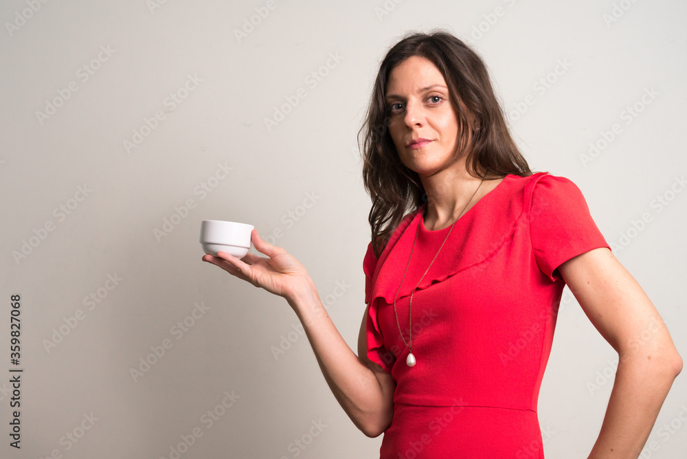 Portrait of beautiful businesswoman holding coffee cup Portrait of beautiful businesswoman holding coffee cup