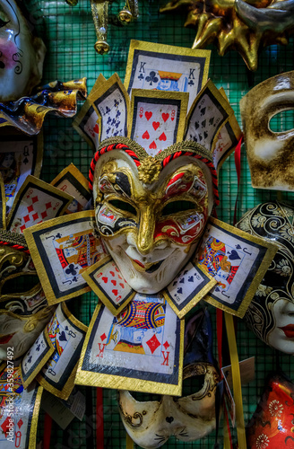 Traditional ornate Venetian carnival masks on display at a craftsman workshop studio and store in Venice, Italy