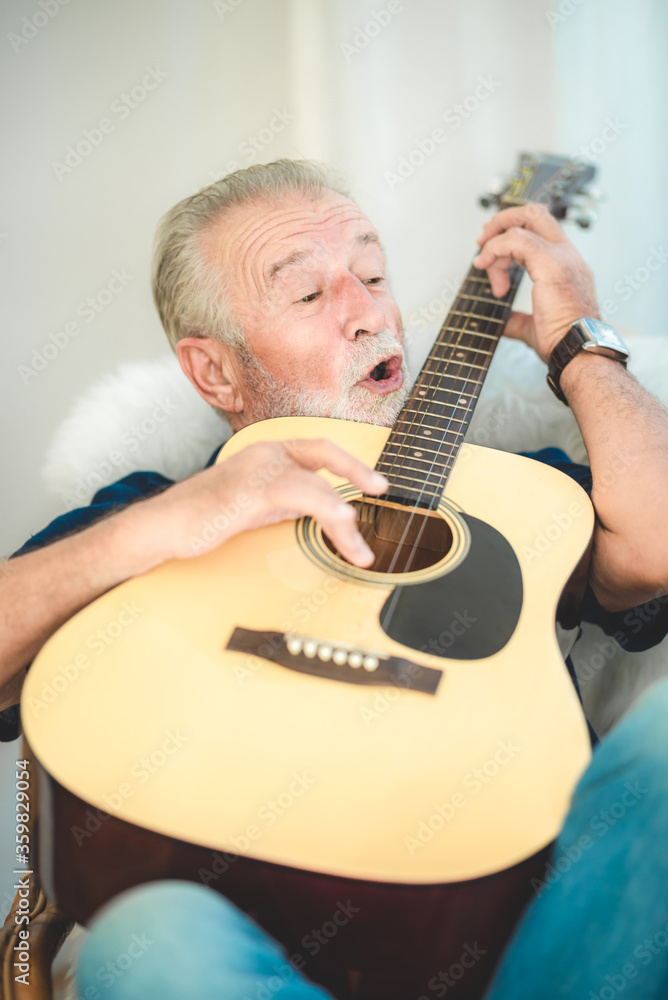 Obraz premium seniors father, elderly dad are playing guitar and music at home, relax activity and stay at home with family