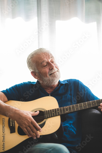 seniors father, elderly dad are playing guitar and music at home, relax activity and stay at home with family