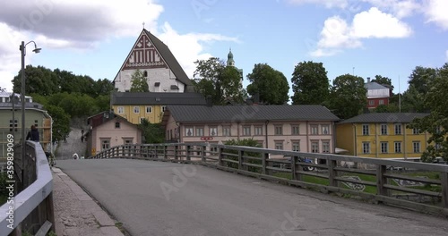 4K video of Porvoo vintage red wooden buildings, Porvoo Cathedral, yachts and boats in Porvoonjoki River near town center on sunny summer day in Finland, northern Europe photo