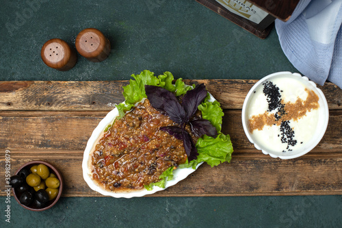 Caucasian mangal salad with olives and yogurt. top view photo