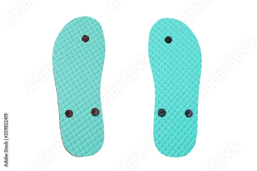 Sole of a pair of flip flops slippers, showing the tread pattern on the bottom, isolated on white background.