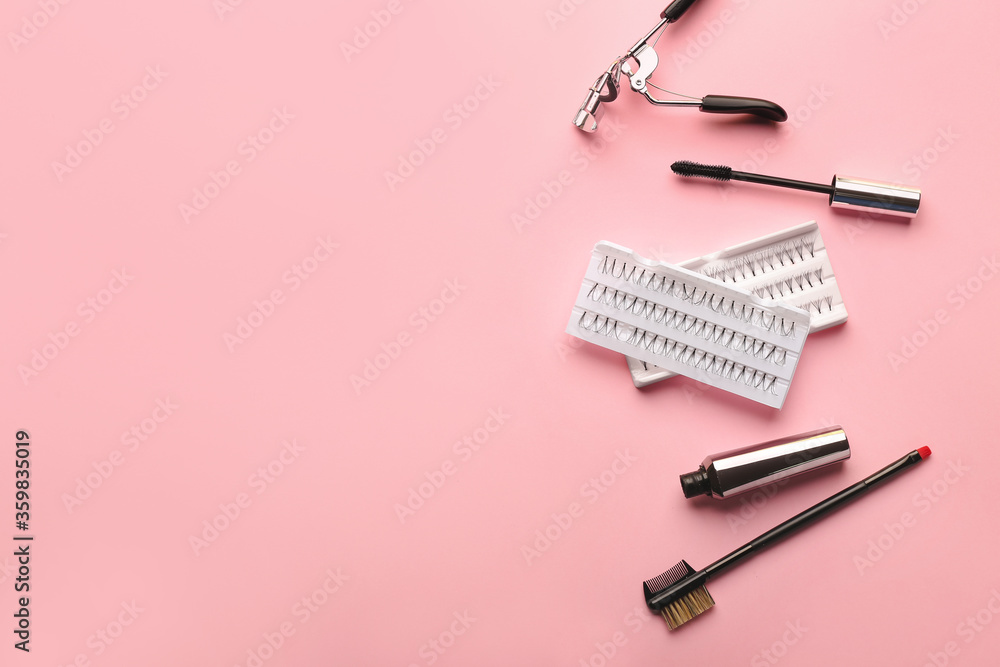 Mascara, eyelash extensions, brush and curler on color background Mascara, eyelash extensions, brush and curler on color background