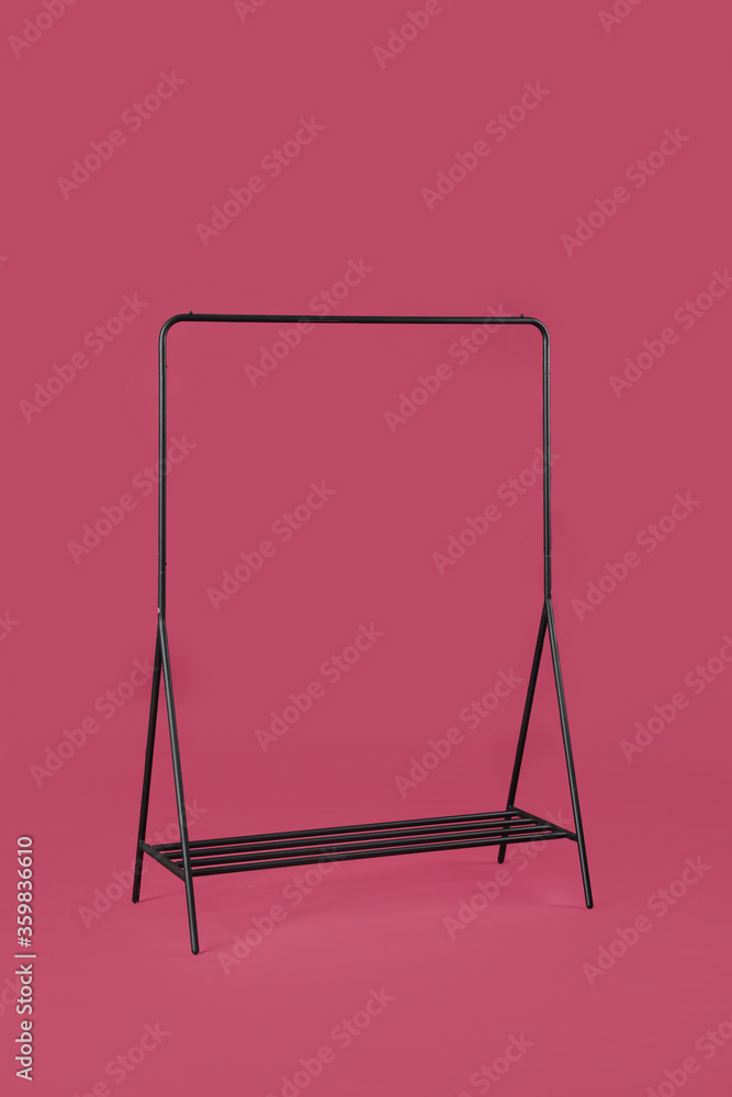 Stylish clothes hanger on color background Stylish clothes hanger on color background