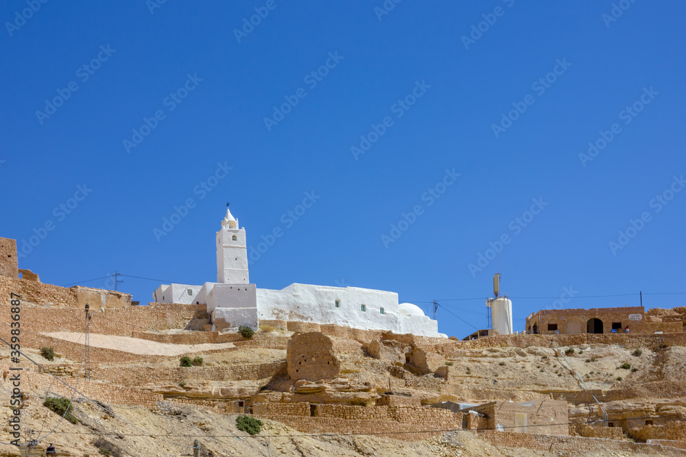 White mosque on top of a hill in Berber village, Sahara