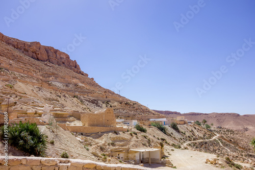 Berber village in the sandstone mountain in the Sahara, Africa © gummy-beer