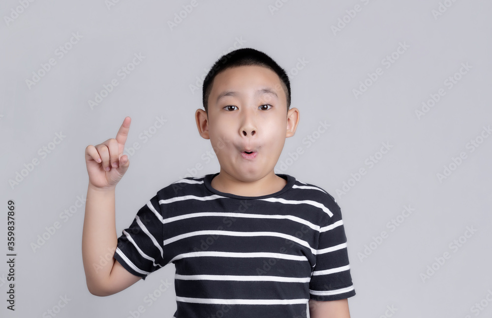 Asian boys studio portrait on gray background Asian boys studio portrait on gray background