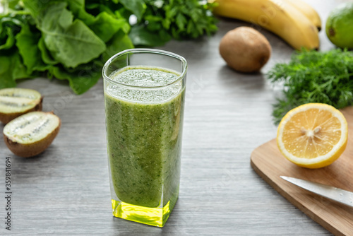 Healthy green smoothie made from fruits, vegetables and greens.