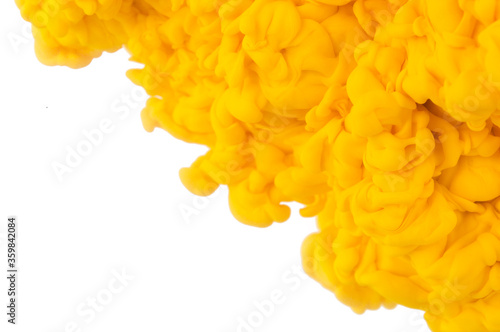 yellow Abstract acrylic paint color swirls in water isolated on white background