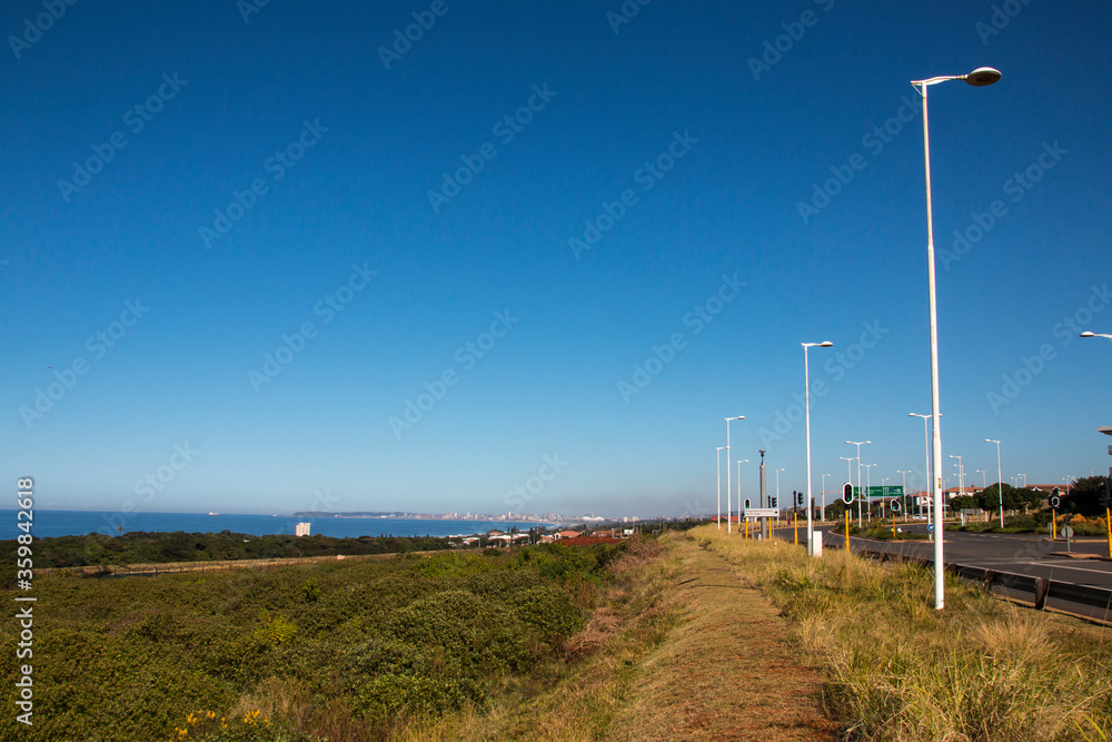 Coastal Road Leading into Durban with Vegetation off Coastline