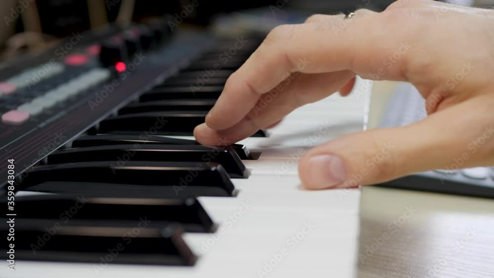 Male playing piano synthesizer keyboard. Classical, musical art. Music and concert concept Male playing piano synthesizer keyboard. Classical, musical art. Music and concert concept