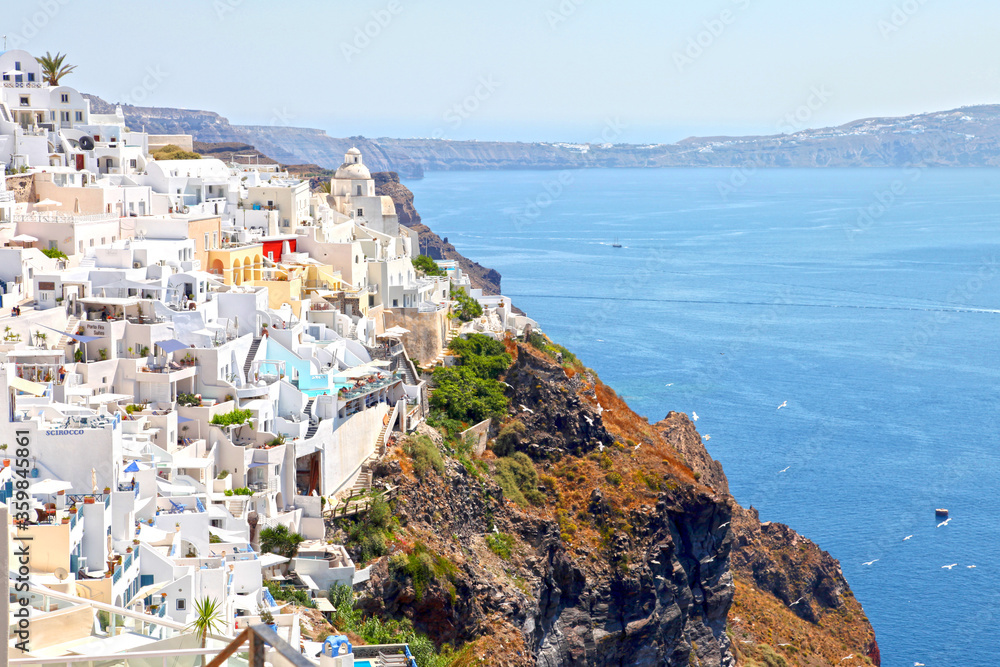 View of Fira town at the top of a cliff in Santorini, Greece.
