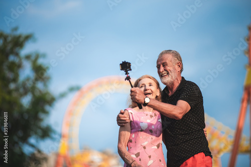 Senior couple taking a self...