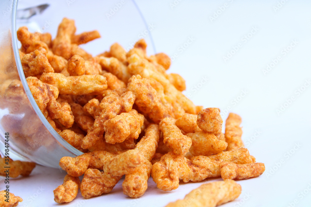 yummy tasty crunchy snacks drop from a transparent bowl yummy tasty crunchy snacks drop from a transparent bowl