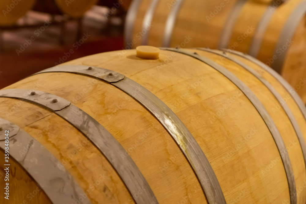 oak barrel wine with iron hoop and cork close-up drink storage oak barrel wine with iron hoop and cork close-up drink storage