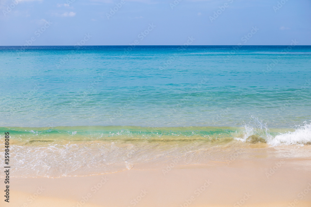 Beautiful clean beach with summer outdoor day light, clean sea water on find sand beach, blue sea water and clear blue sky, nature and environmental concept background Beautiful clean beach with summer outdoor day light, clean sea water on find sand beach, blue sea water and clear blue sky, nature and environmental concept background