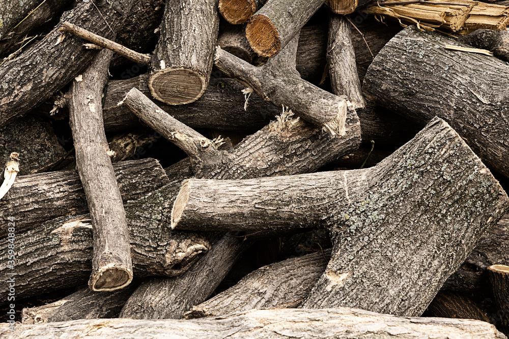 wooden trunk folded in pile to clean the forest used as fuel close-up background wooden trunk folded in pile to clean the forest used as fuel close-up background