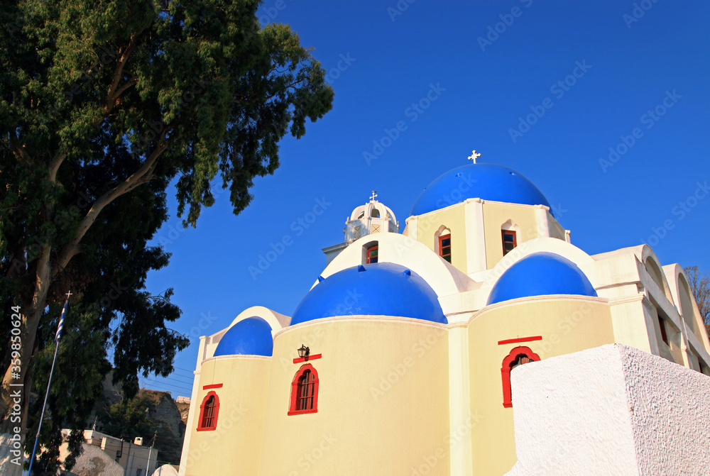 A blue-domed church in Santorini, Greece.