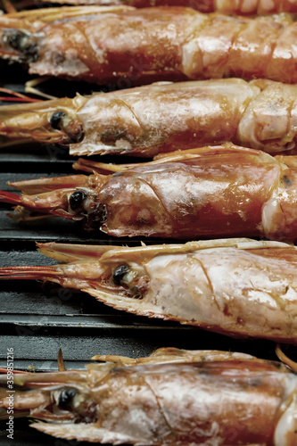 shrimp head large royal barbecue preparation, vertical photograph