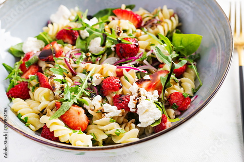 Pasta salad. Fusilli Pasta - salad with strawberry, feta cheese, red onion and balsamic sauce.
