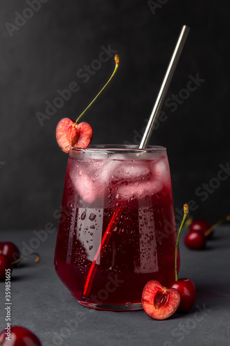 Refreshing cocktail with cherries and ice