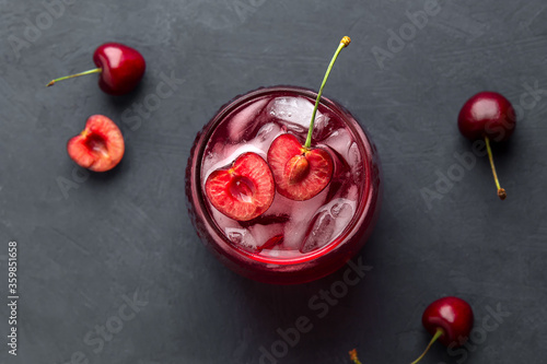 Flat lay with fruit drink made of cherries and ice