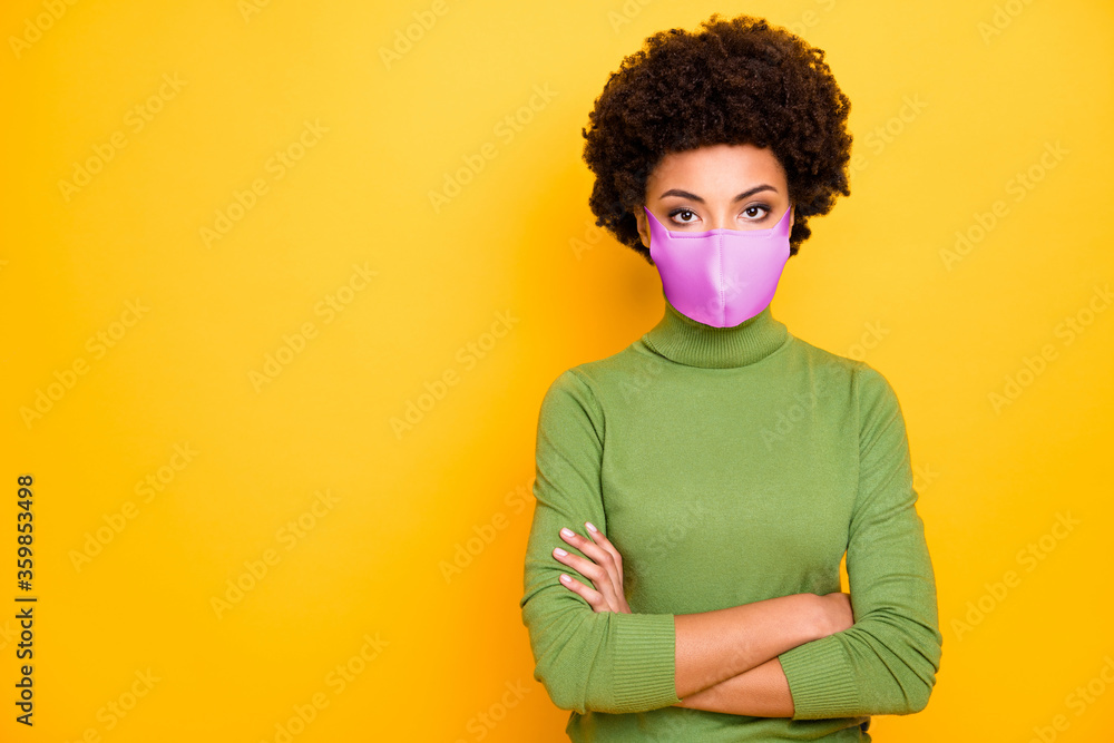 Portrait of her she confident healthy wavy-haired girl wearing cotton textile reusable mask folded arms stay home social distance copy space isolated bright vivid shine vibrant yellow color background Portrait of her she confident healthy wavy-haired girl wearing cotton textile reusable mask folded arms stay home social distance copy space isolated bright vivid shine vibrant yellow color background