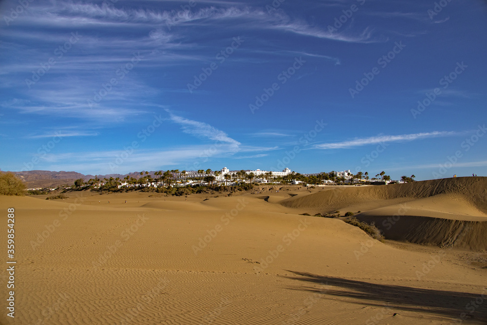 summer desert landscape on a warm sunny day from Maspalomas dunes on the Spanish island of Gran Canaria summer desert landscape on a warm sunny day from Maspalomas dunes on the Spanish island of Gran Canaria