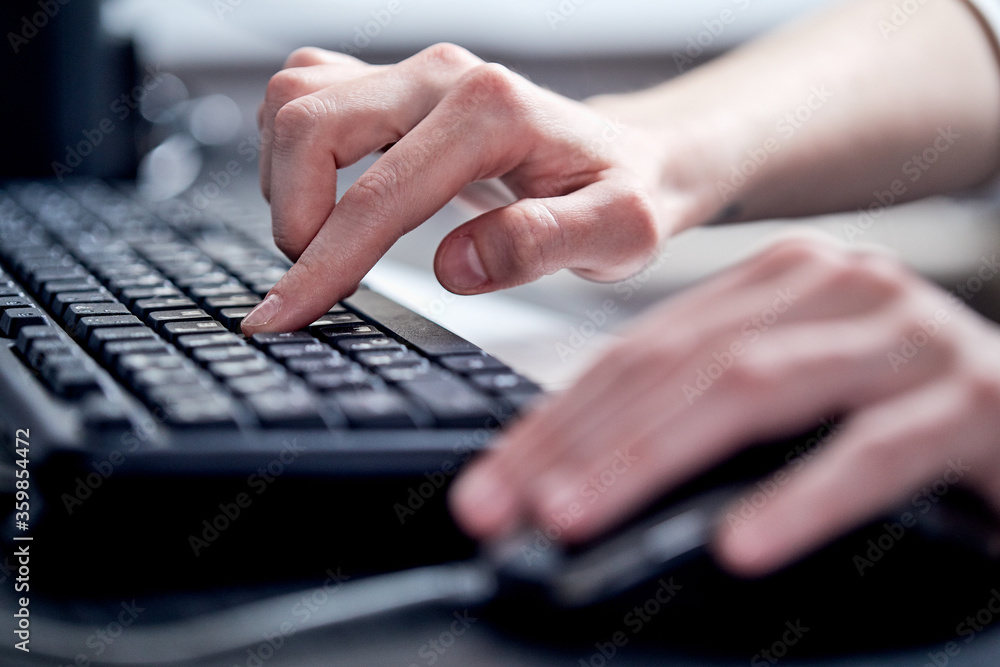 Female hands or woman office worker typing on the keyboard Female hands or woman office worker typing on the keyboard