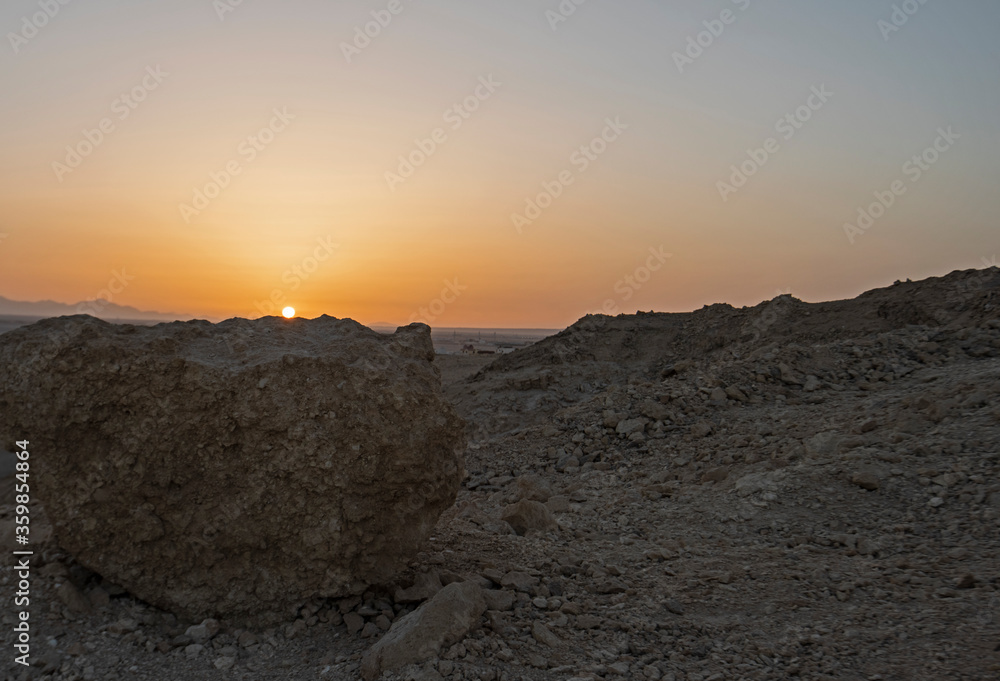 Remote rocky african desert landscape at sunset