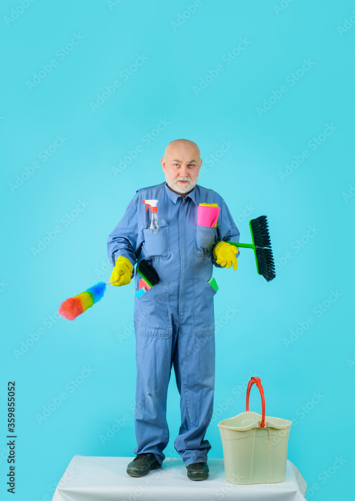 Disinfection. Cleaning service. Man with cleaning equipment. Domestic service. Professional cleaning. Clean up. Clearing tools. Broom. Dust brush. Household. Housekeeping.