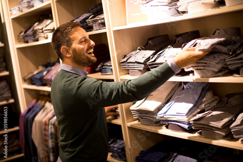 Handsome young man buying c...