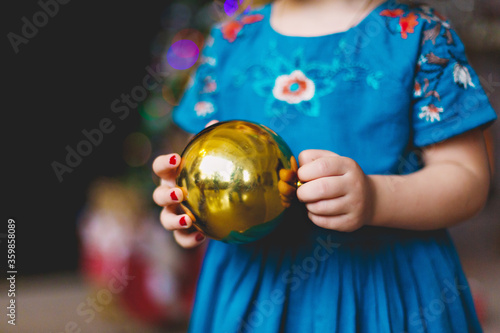 little girl with christmas ball