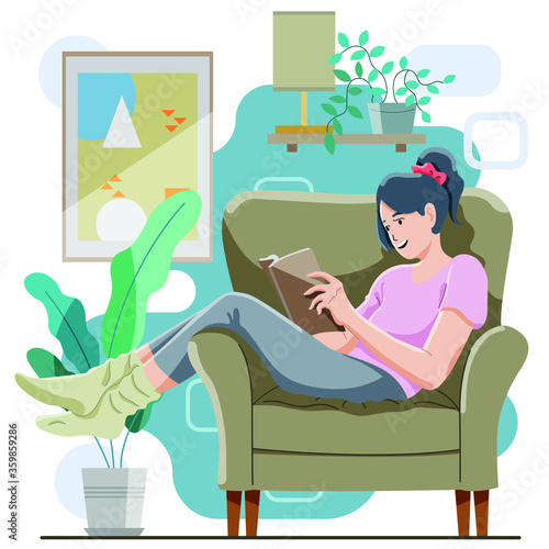 young man sitting on sofa reading book