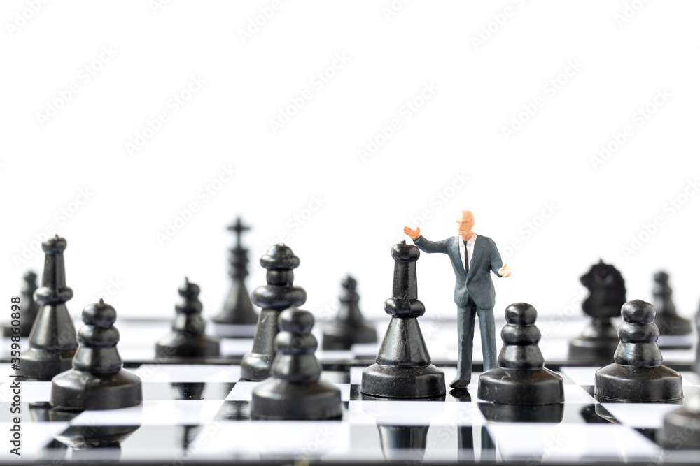 Miniature people Businessman standing on chessboard , Business and Competition Concept Miniature people Businessman standing on chessboard , Business and Competition Concept
