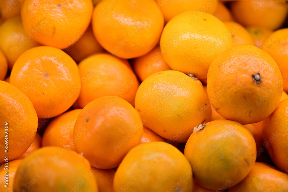 Photo of a lot of orange ready for sale on a tray Photo of a lot of orange ready for sale on a tray