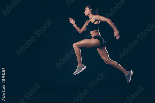Full size profile photo short sport suit lady sprint run jogger inspired to win race first place member isolated black background