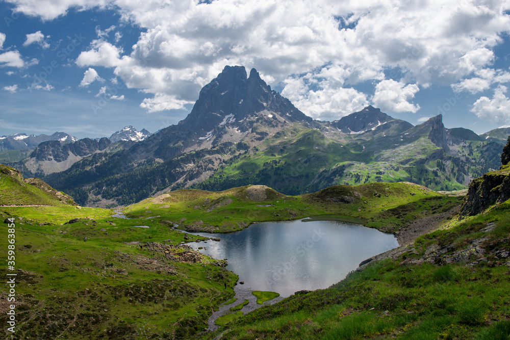 Pic du Midi Ossau and Ayous lake in french Pyrenees mountains Pic du Midi Ossau and Ayous lake in french Pyrenees mountains