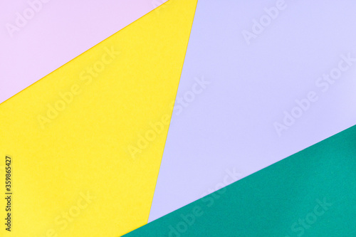 Abstract blank background for template, geometrical pattern made from green, violet, pink and yellow paper, horizontal, copy space