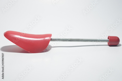 Red Plastic Shoe Tree on White Isolated Background