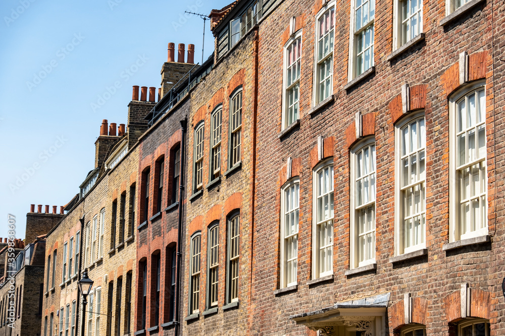 London- Historic brick townhouse buildings in Spitalfields area of East London